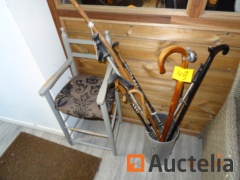2 Chairs Child, a wooden shelf with menu and salt, a door umbrella with lot of various walking rods